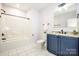 Bathroom featuring a vanity with granite countertops, shower and tub combination, and marble floors at 7039 Executive Cir, Denver, NC 28037