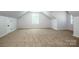 Bright bedroom with neutral carpeting and a window that provides natural light at 7039 Executive Cir, Denver, NC 28037