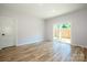Bright and airy bedroom with hardwood floors, closet, and natural light at 7039 Executive Cir, Denver, NC 28037