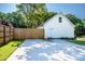 Exterior view of the home features a long driveway leading to a quaint white house at 7039 Executive Cir, Denver, NC 28037