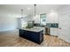 Stylish kitchen with a large island, stainless steel appliances, and modern backsplash at 7039 Executive Cir, Denver, NC 28037