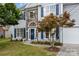 Charming home featuring stone accents, blue shutters, manicured lawn, and an inviting walkway at 7623 Rathburn Ln, Charlotte, NC 28277