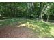 Chain link fenced backyard surrounded by green trees at 792 W Nc Hwy 150 St, Lincolnton, NC 28092