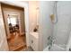 Bathroom featuring patterned floors, a shower tub with a tiled wall and an elephant themed curtain at 792 W Nc Hwy 150 St, Lincolnton, NC 28092
