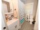 Bathroom featuring patterned floors, a sink vanity, and a shower tub with an elephant themed curtain at 792 W Nc Hwy 150 St, Lincolnton, NC 28092