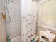 Bathroom featuring patterned floors, a shower tub with a tiled wall and an elephant themed curtain at 792 W Nc Hwy 150 St, Lincolnton, NC 28092