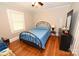 Cozy bedroom with hardwood floors, a comfortable bed, and natural light from the window at 792 W Nc Hwy 150 St, Lincolnton, NC 28092