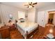 Cozy bedroom with hardwood floors, ceiling fan, and large double door closet at 792 W Nc Hwy 150 St, Lincolnton, NC 28092