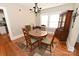 Charming dining room with hardwood floors, a chandelier, a round table with four chairs, and a hutch at 792 W Nc Hwy 150 St, Lincolnton, NC 28092