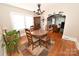 Charming dining room with hardwood floors, a chandelier, a round table with four chairs, and a colorful area rug at 792 W Nc Hwy 150 St, Lincolnton, NC 28092