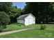 Detached white garage with a large lawn and a walkway leading up to it at 792 W Nc Hwy 150 St, Lincolnton, NC 28092