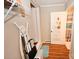 Hallway leading to bathroom with ironing board at 792 W Nc Hwy 150 St, Lincolnton, NC 28092