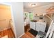 Well-equipped laundry room with washer, dryer, and access to outdoor deck at 792 W Nc Hwy 150 St, Lincolnton, NC 28092
