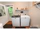 Laundry room with washer, dryer, and access to outdoor deck at 792 W Nc Hwy 150 St, Lincolnton, NC 28092
