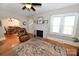 Open living room view with hardwood floors, fireplace, archways, and natural light at 792 W Nc Hwy 150 St, Lincolnton, NC 28092