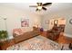 Comfortable living room featuring hardwood floors, neutral walls, a cozy couch, and an archway view to dining area at 792 W Nc Hwy 150 St, Lincolnton, NC 28092