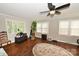 Bright living room featuring hardwood floors, neutral walls, ceiling fan and plentiful windows with natural light at 792 W Nc Hwy 150 St, Lincolnton, NC 28092