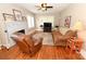 Bright living room featuring hardwood floors, a fireplace, a comfy couch, and natural lighting at 792 W Nc Hwy 150 St, Lincolnton, NC 28092