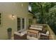 Outdoor deck with wicker seating and a table, accessible from the house through double doors at 8510 Glade Ct, Huntersville, NC 28078