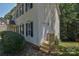 Two-story home featuring white siding, black shutters, and a well-maintained yard at 8510 Glade Ct, Huntersville, NC 28078