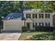 Charming two-story home with a well-manicured front lawn and attached garage at 8510 Glade Ct, Huntersville, NC 28078