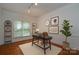 Well-lit home office with a modern desk, a comfortable chair, and stylish decor at 8510 Glade Ct, Huntersville, NC 28078