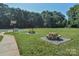 Community picnic area with tables and basketball and soccer fields surrounded by trees at 8510 Glade Ct, Huntersville, NC 28078