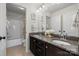 Dual-sink bathroom with granite countertops, modern fixtures, and a separate shower and tub area at 958 Skywater Dr, Fort Mill, SC 29715
