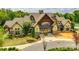 Elegant clubhouse with stone and siding exterior, featuring a covered entrance and manicured landscaping at 958 Skywater Dr, Fort Mill, SC 29715