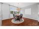 Bright dining area boasts hardwood floors, large window, and stylish light fixture at 958 Skywater Dr, Fort Mill, SC 29715