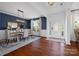 Elegant dining room featuring hardwood floors, stylish chandelier, and blue accent wall at 958 Skywater Dr, Fort Mill, SC 29715