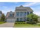 Charming two-story home with a two car garage, inviting front porch, and manicured landscaping at 958 Skywater Dr, Fort Mill, SC 29715