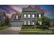 Charming two-story home featuring a welcoming front porch, two-car garage, and beautifully landscaped yard at 958 Skywater Dr, Fort Mill, SC 29715