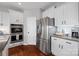 Contemporary kitchen featuring stainless steel appliances, granite countertops, and white cabinets at 958 Skywater Dr, Fort Mill, SC 29715