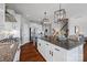 Gourmet kitchen island with granite countertops, stainless steel sink, and seating at 958 Skywater Dr, Fort Mill, SC 29715
