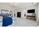 Spacious main bedroom with hardwood floors, large TV, and adjoining bathroom at 958 Skywater Dr, Fort Mill, SC 29715