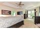 Main bedroom features a tray ceiling, a large window, and dark wood furniture at 9600 Lockhorn Ct, Mint Hill, NC 28227
