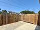 Back yard features a wood fence and concrete paver patio at 9730 Elizabeth Townes Ln, Charlotte, NC 28277