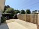 Paver patio surrounded by a wood fence, offering privacy in the back yard at 9730 Elizabeth Townes Ln, Charlotte, NC 28277