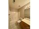 Standard bathroom featuring a shower-tub combo and single sink vanity at 9730 Elizabeth Townes Ln, Charlotte, NC 28277