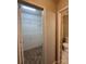 Well-organized walk-in closet with shelving, adjacent to a conveniently located half-bathroom at 9730 Elizabeth Townes Ln, Charlotte, NC 28277
