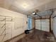 Spacious two car garage with storage shelves and door to house at 9730 Elizabeth Townes Ln, Charlotte, NC 28277