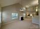 Bright and airy living room with a fireplace, vaulted ceiling, and open layout perfect for entertaining at 9730 Elizabeth Townes Ln, Charlotte, NC 28277