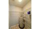 Utility room features a water heater and storage shelves at 9730 Elizabeth Townes Ln, Charlotte, NC 28277