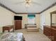 Spacious bedroom with neutral carpet, ceiling fan, and furniture sets, complemented by a window at 1302 Hawthorne Rd, Lancaster, SC 29720