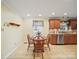 Eat-in kitchen with wood table and chairs, stainless steel appliances, and tile flooring at 1302 Hawthorne Rd, Lancaster, SC 29720