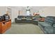 Large seating area with couches, shelving, and a window with natural light at 1302 Hawthorne Rd, Lancaster, SC 29720