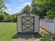Outdoor storage shed with double doors and a small ramp at 1302 Hawthorne Rd, Lancaster, SC 29720