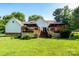 Expansive backyard with a well-maintained lawn, deck, and privacy fence at 135 Primrose Dr, Salisbury, NC 28147