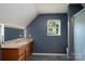 Modern bathroom with granite countertop vanity and a lighted mirror, creating a sleek and luxurious space at 135 Primrose Dr, Salisbury, NC 28147